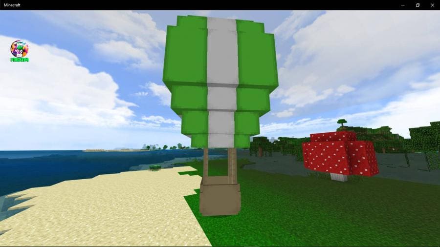 Зеленый вариант воздушного шара на песчаном берегу