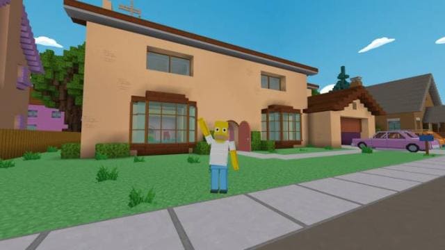 Гомер Симпсон машет рукой на улице